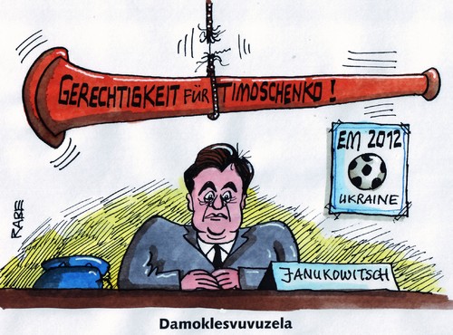 Cartoon: Protestvuvuzela (medium) by RABE tagged fußball,em,ukraine,kiew,janukowitsch,oppositionsführerin,timoschenko,haft,gefängnis,gerechtigkeit,freiheit,damokles,damoklesschwert,vuvuzela,fans,machthaber,unterdrückung,fußball,ukraine,janukowitsch,oppositionsführerin,timoschenko,gefängnis,haft,gerechtigkeit,em